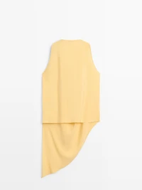 Top long fluide asymétrique