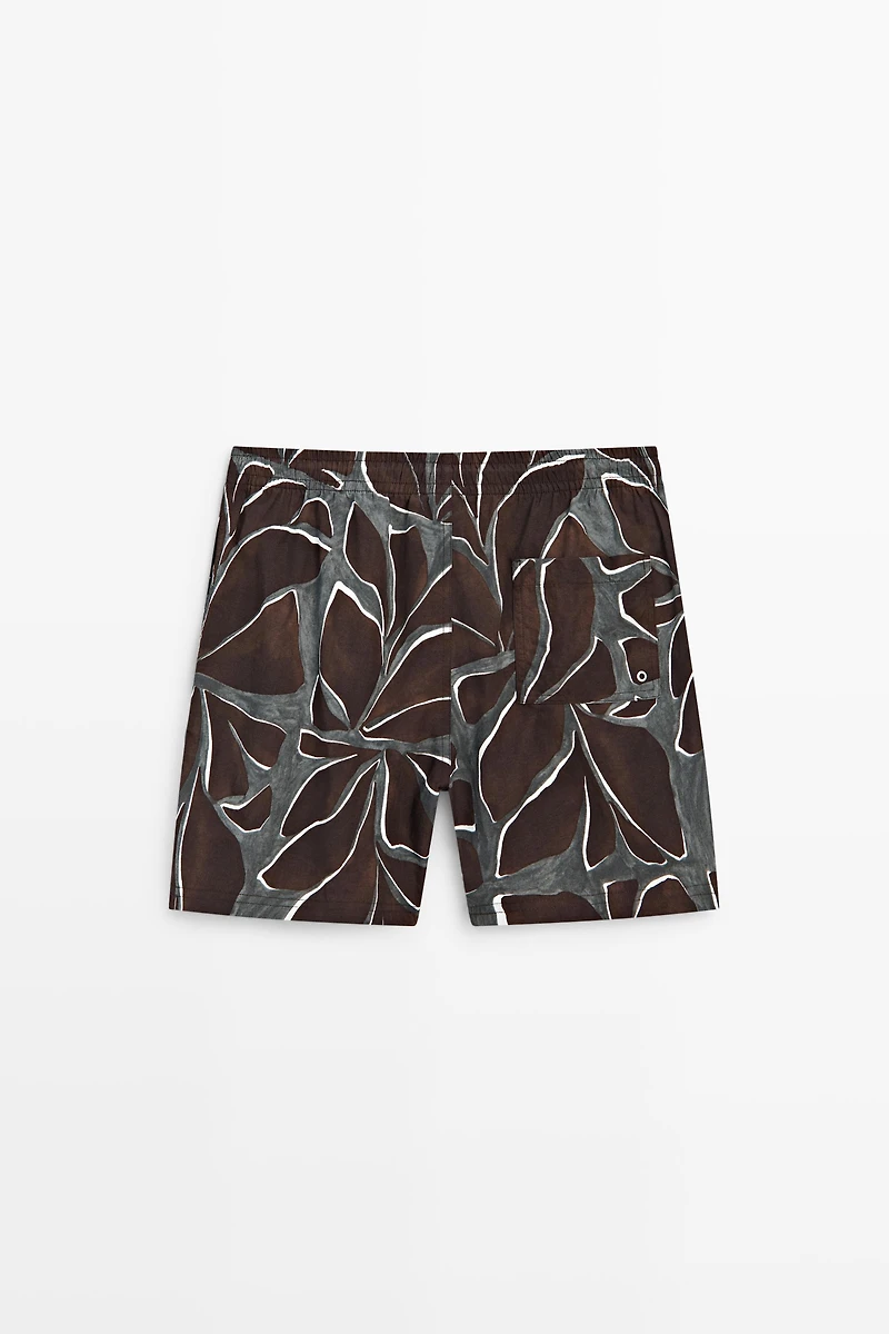 Tropical print swimming trunks