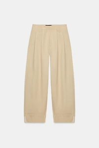 PANTALON À PINCES ET BAS REVERS