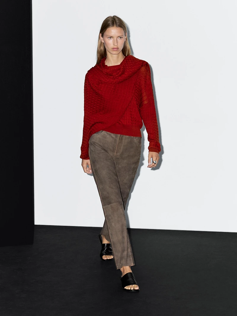 Cable-knit sweater with scarf detail