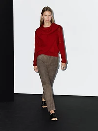 Cable-knit sweater with scarf detail
