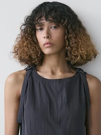 Flowing midi dress with buckles