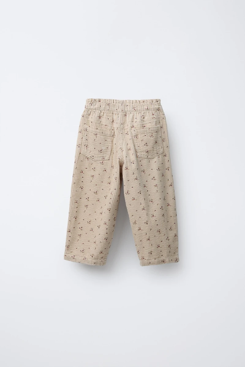 PANTALON EN VELOURS CÔTELÉ À FLEURS