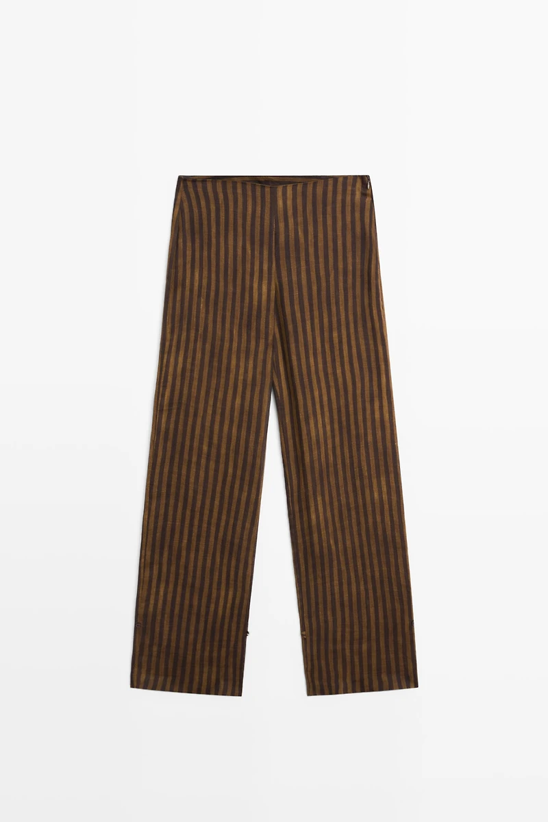 Total look flowing striped pants with button hem
