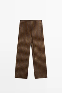 Total look flowing striped pants with button hem