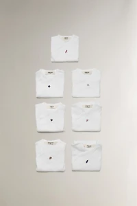EMBROIDERED COTTON BODYSUIT SET (PACK OF 7)