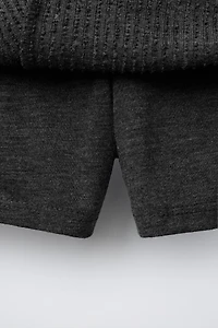 JUPE-SHORT EN MAILLE CÔTELÉE À VOLANTS