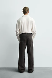 WAXED FLARE FIT JEANS