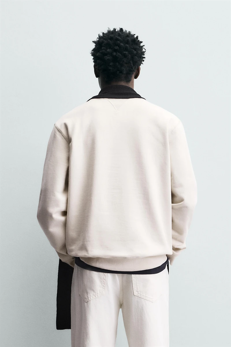 SWEAT À INSCRIPTION BRODÉE