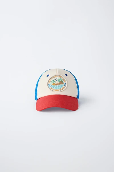 CASQUETTE À PIÈCE ET RÉSILLE