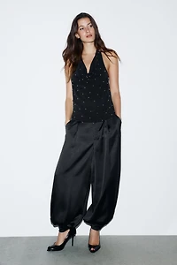 PLEATED SATIN PANTS