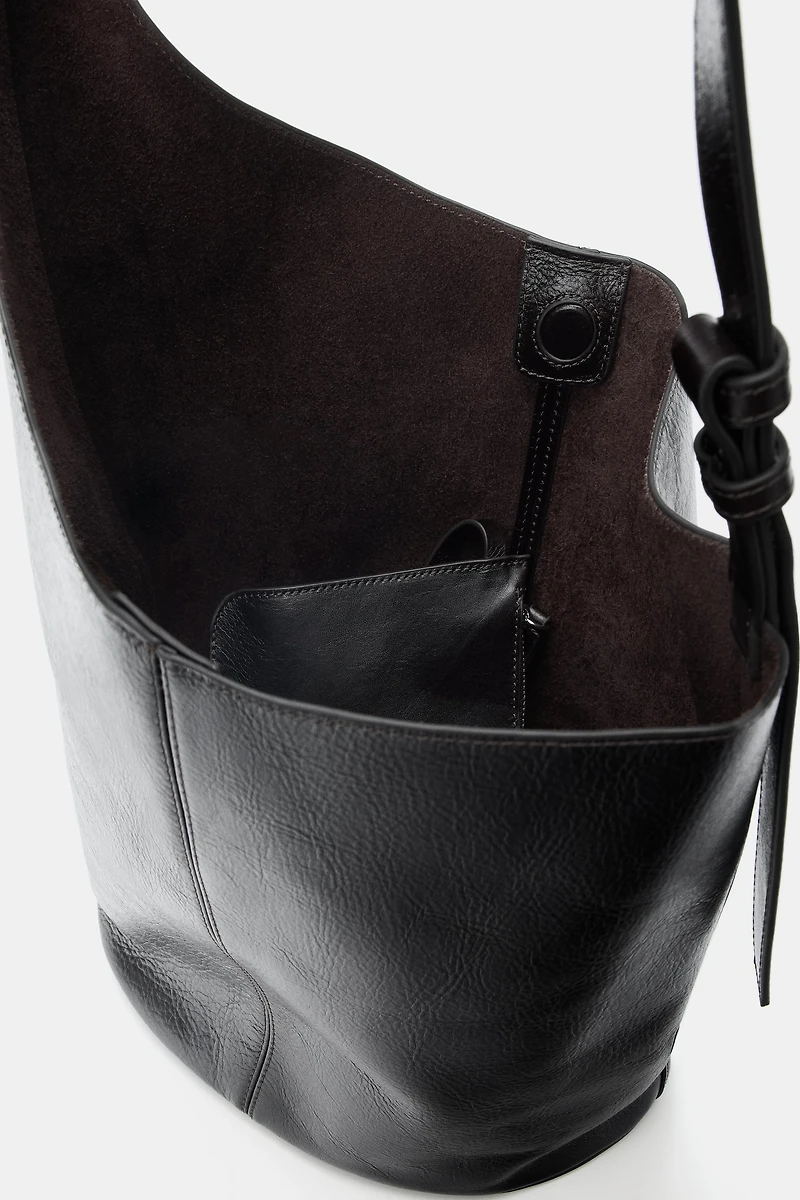 ASYMMETRIC LEATHER BUCKET BAG
