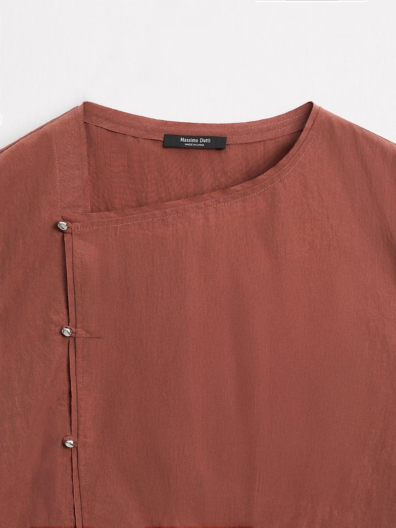 Blouse boutonnage côté argenté