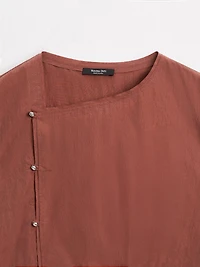 Blouse boutonnage côté argenté