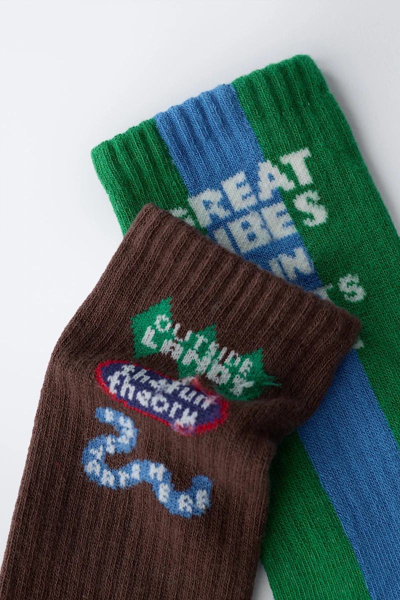 TWO-PACK OF LONG SOCKS WITH TEXT PRINT