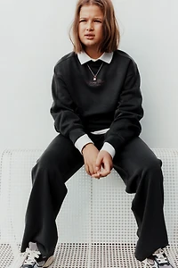 RAISED TEXT SWEATSHIRT