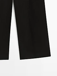 Flowing trousers with pleated details