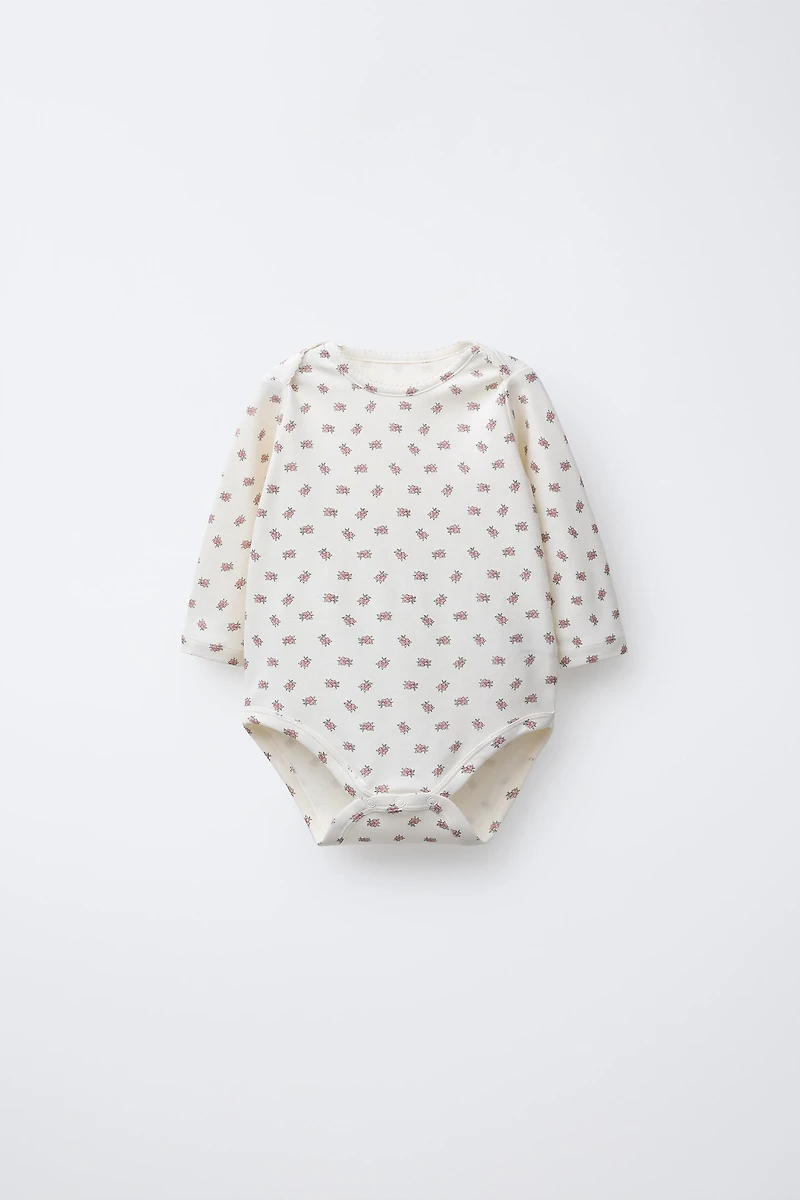FIVE-PACK OF FLORAL BODYSUITS