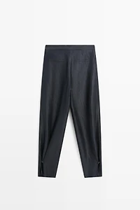 Trousers with gathered hems