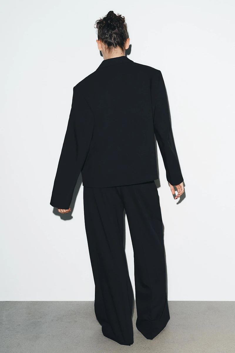 PINSTRIPE PANTS WITH PLEATS AND FLAPS