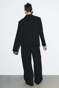 PINSTRIPE PANTS WITH PLEATS AND FLAPS