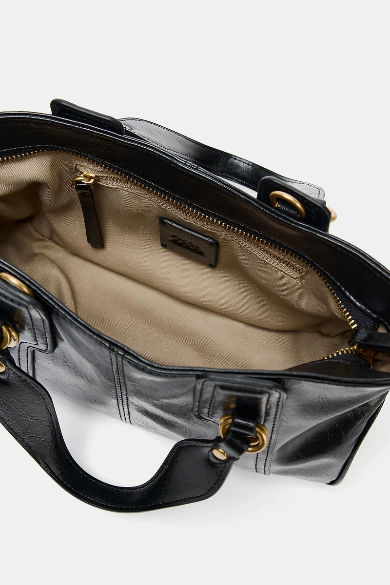 HANDBAG WITH METALLIC DETAILS