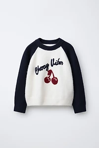 CONTRAST SLEEVE TEXT SWEATER