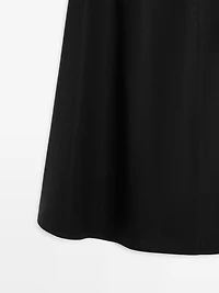 Jupe midi taille marquée