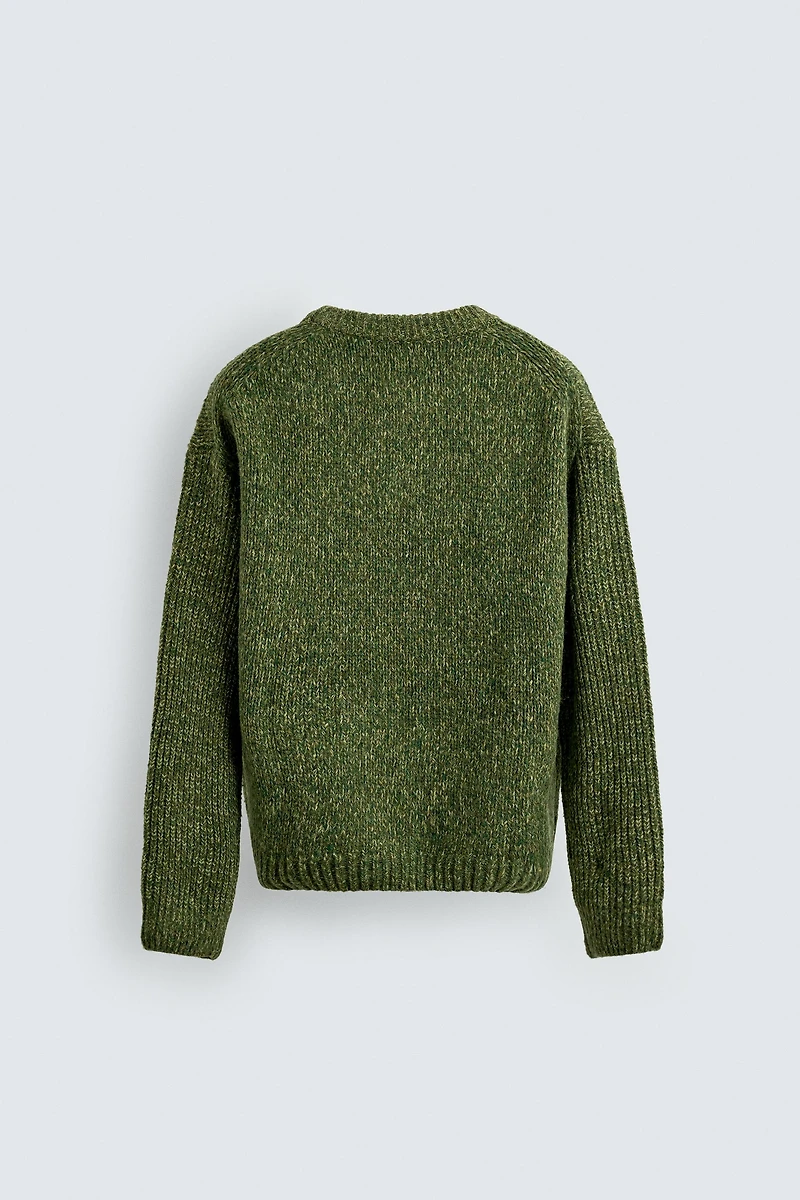 PULL STRUCTURÉ EN FIL RETORS VOLUMINEUX