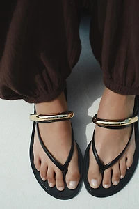 SANDALS WITH METALLIC APPLIQUÉ