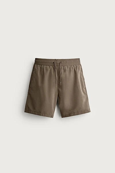 BASIC LONG SWIM TRUNKS