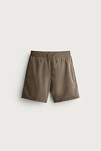 BASIC LONG SWIM TRUNKS