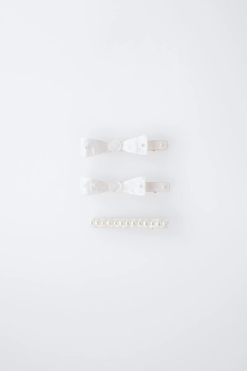 PACK OF THREE MOTHER-OF-PEARL HAIR CLIPS WITH BOWS AND PEARLS