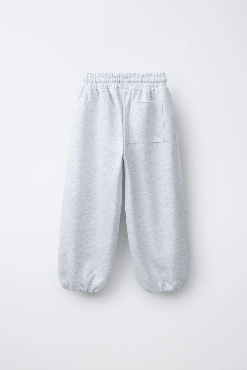 RELAXED RAW EDGE JOGGER PANTS
