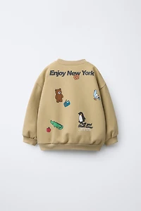 ANIMAL PRINT SWEATSHIRT