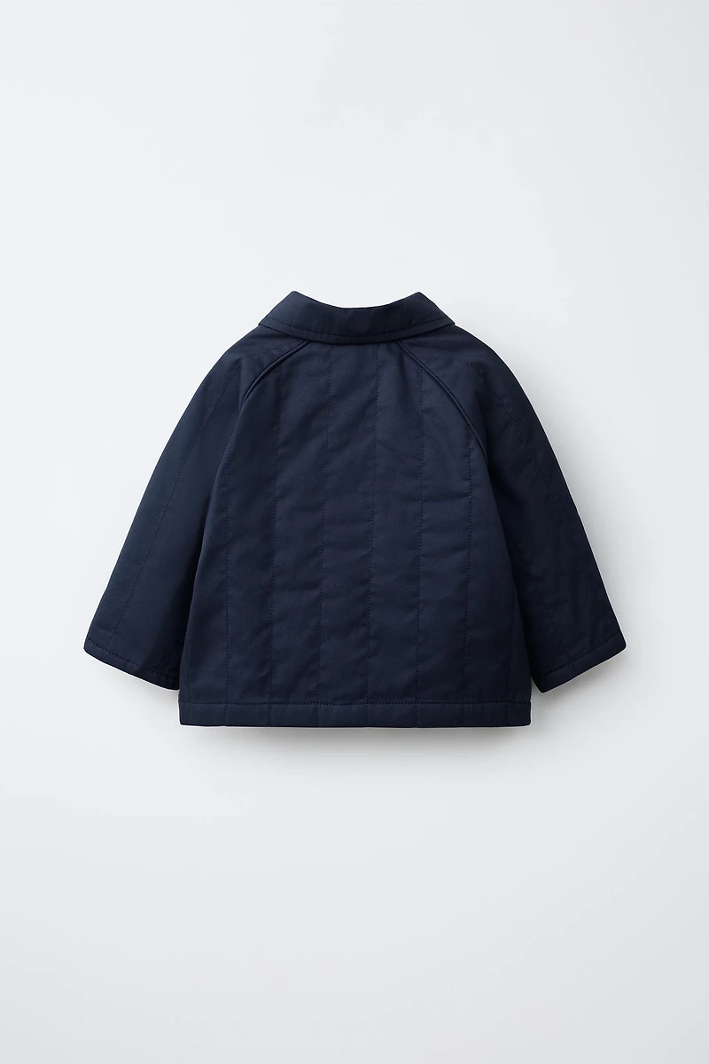 VESTE MATELASSÉE À ÉTIQUETTE