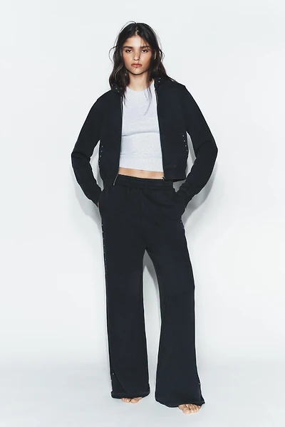 WASHED EFFECT FLEECE PANTS WITH STUDS