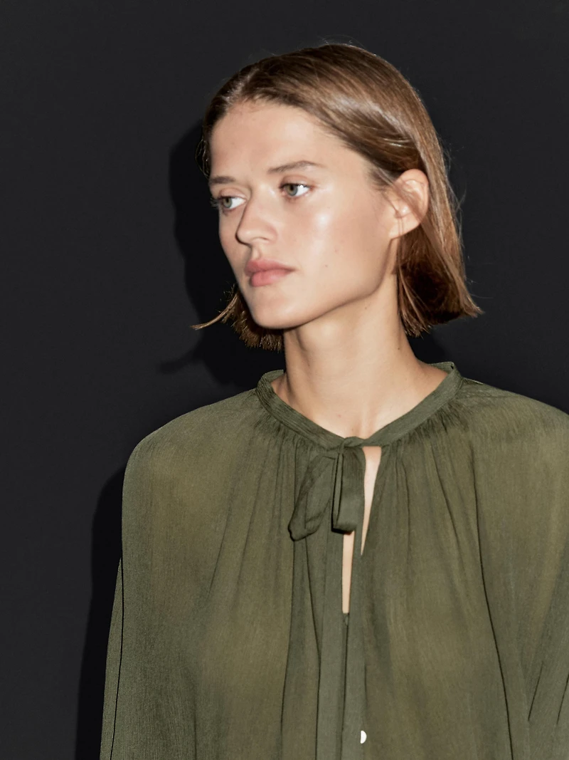 Cape blouse with ties