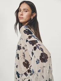 Asymmetric flowing floral print blouse
