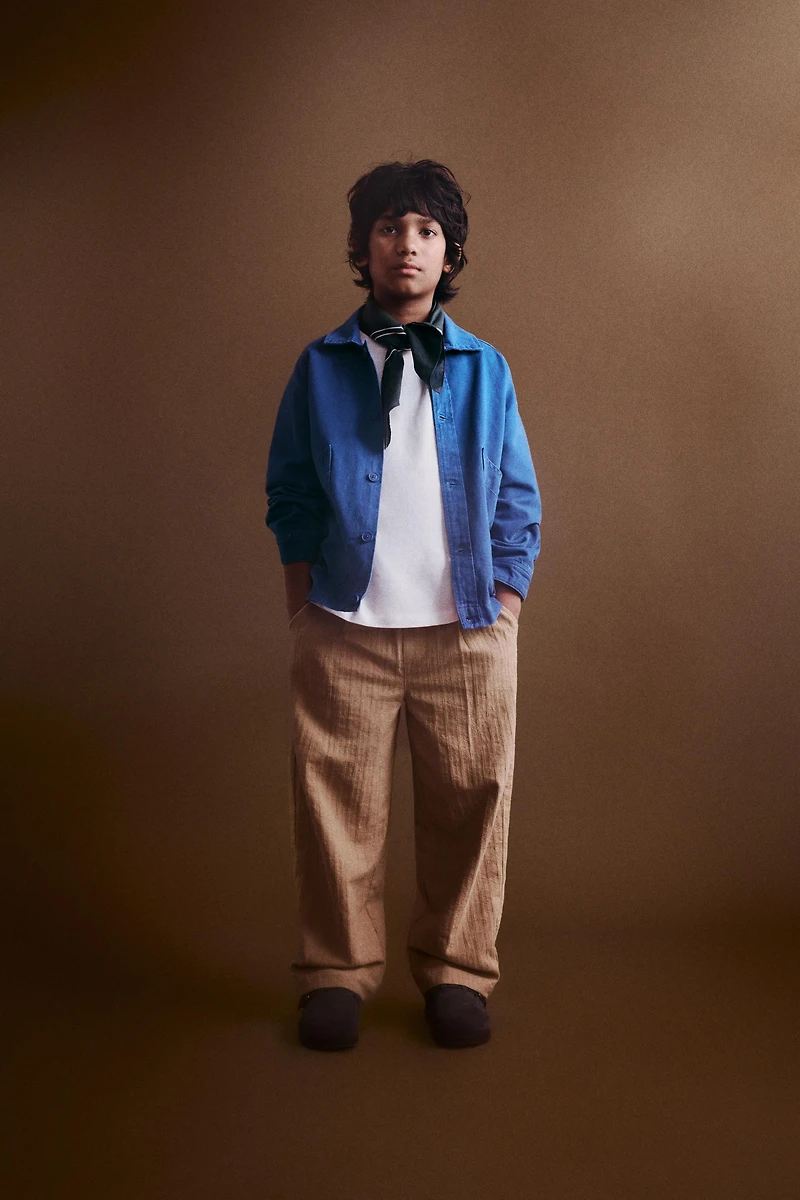 STRAIGHT TEXTURED PLEATED PANTS