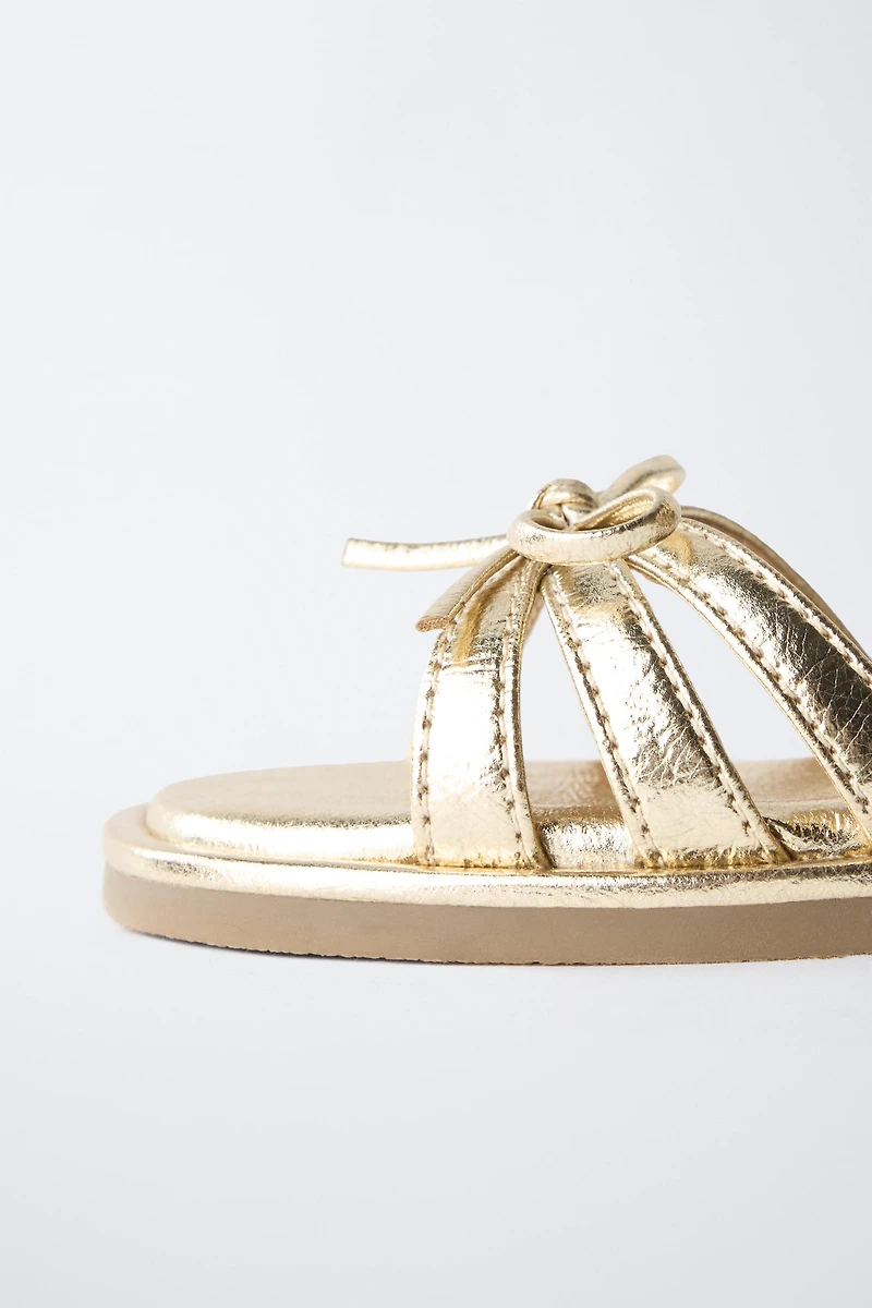 METALLIC BOW SANDALS