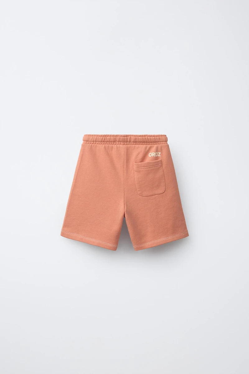 GARMENT DYED LOGO PLUSH SHORTS