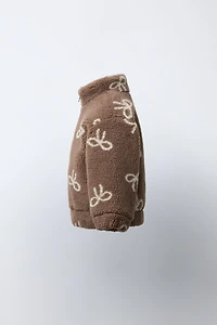 FAUX SHEARLING JACKET WITH BOW PRINT