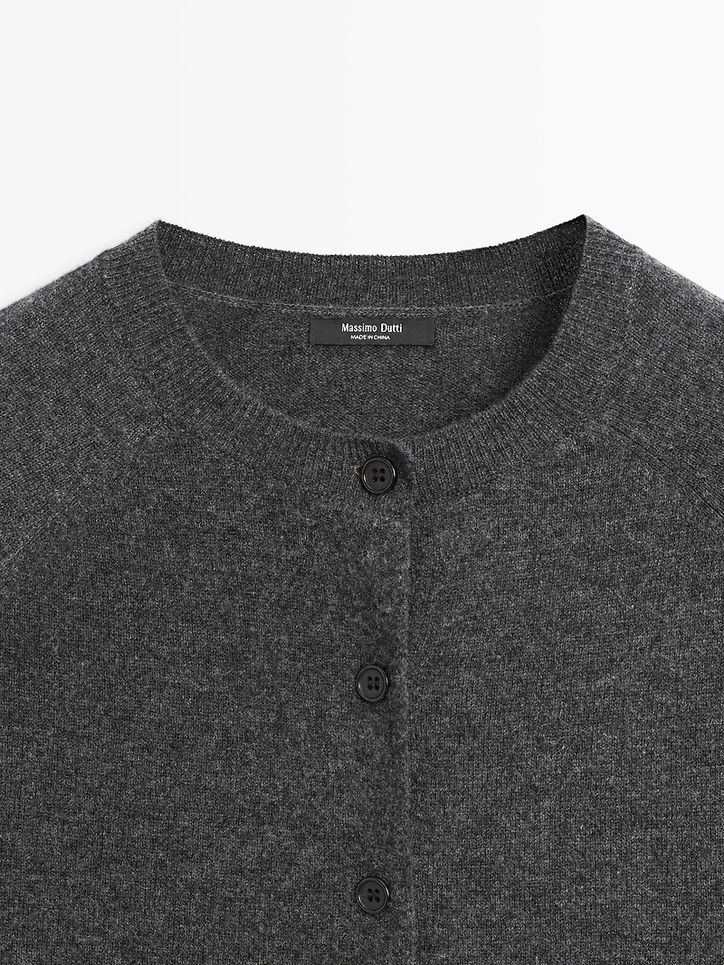 Short knit cardigan with raglan sleeves