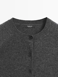 Short knit cardigan with raglan sleeves