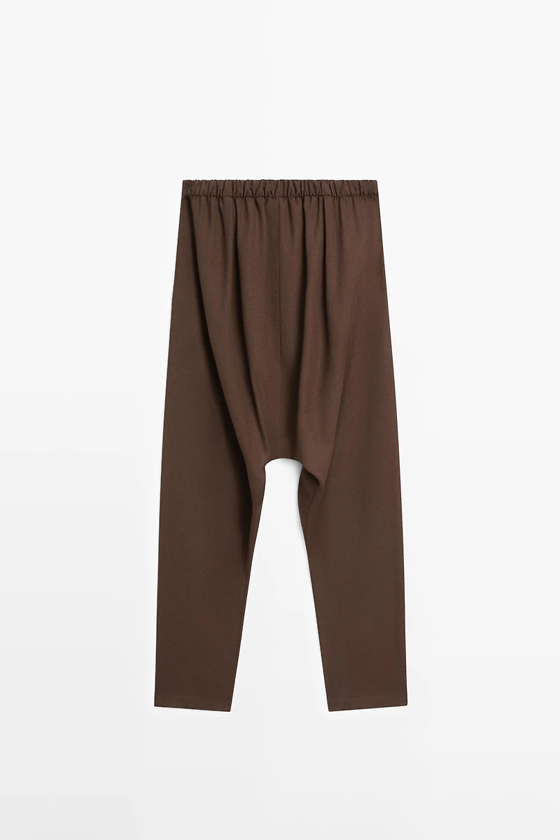 Baggy trousers with pleated details