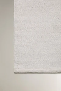 LIGHT-COLORED WOOL AREA RUG