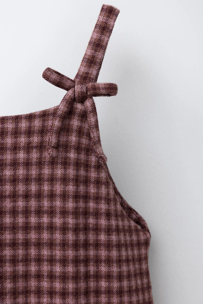 ROBE-SALOPETTE À CARREAUX ET NŒUDS