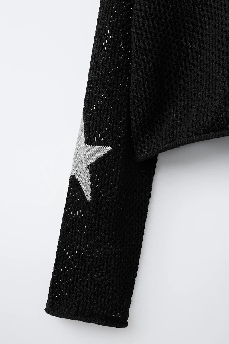 PULL EN MAILLE À CAPUCHE ÉTOILE