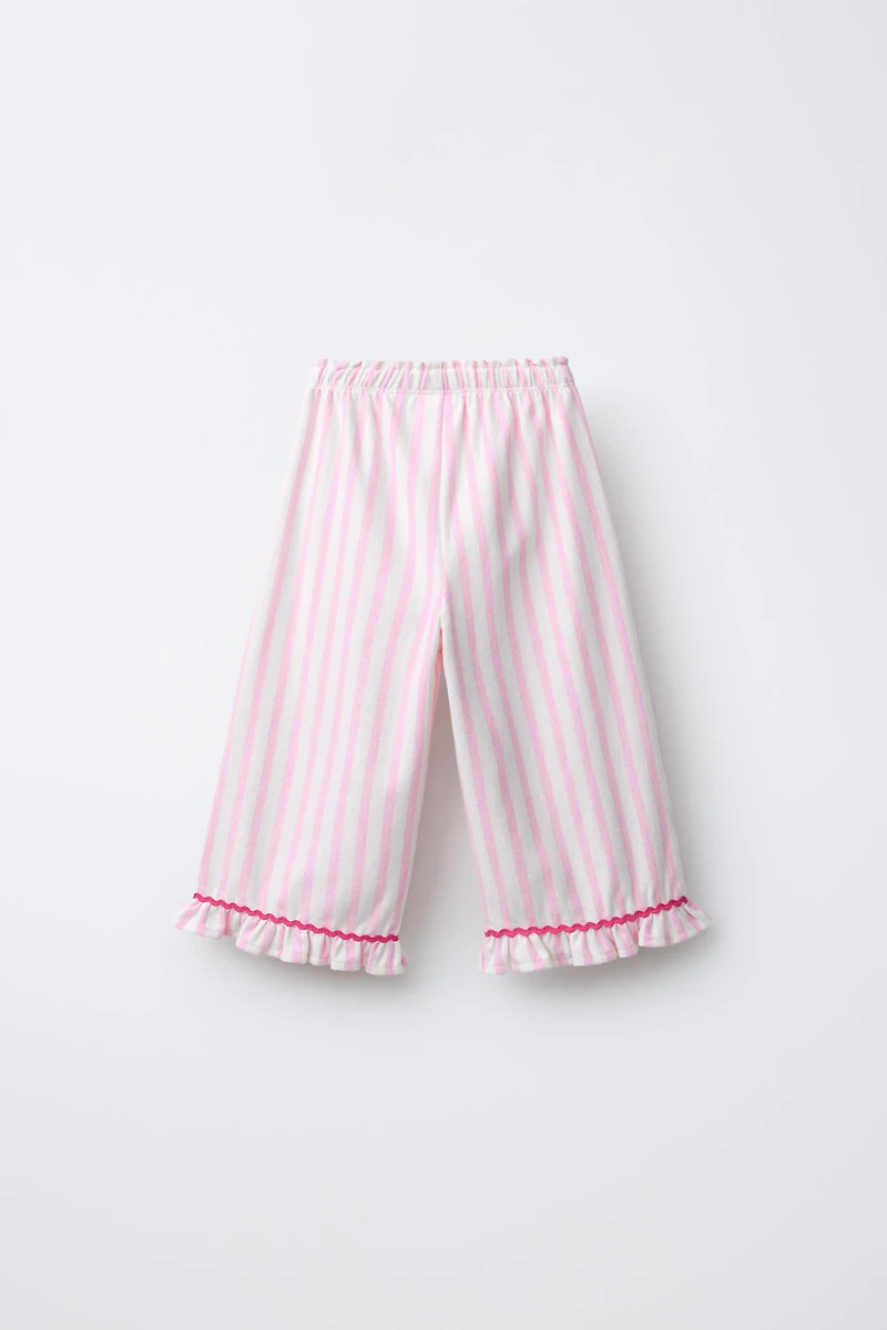 PANTALON À RAYURES TISSÉES ET VOLANTS